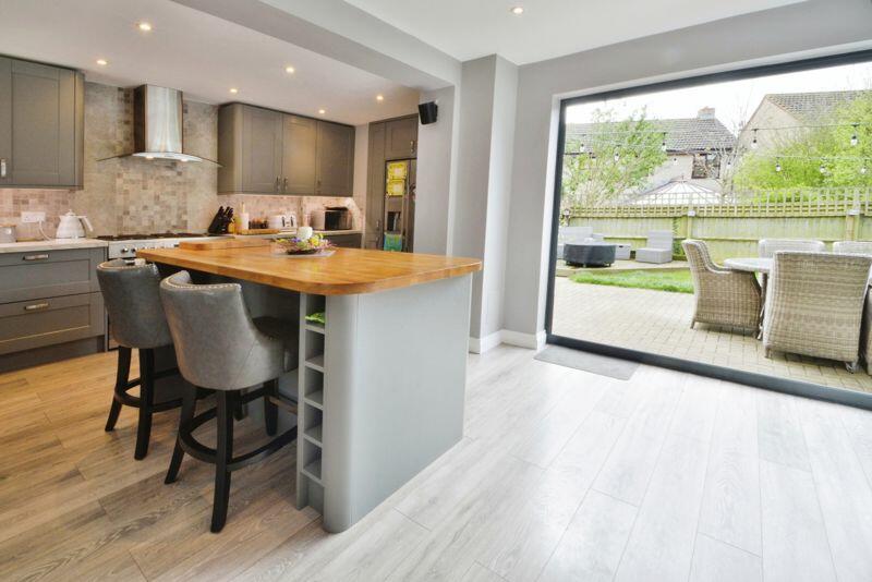 Breakfast bar and bifold doors out
