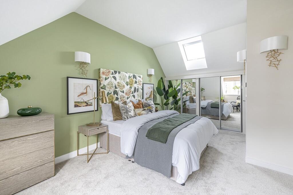 Bedroom one is welcoming and spacious, making use of the whole second floor