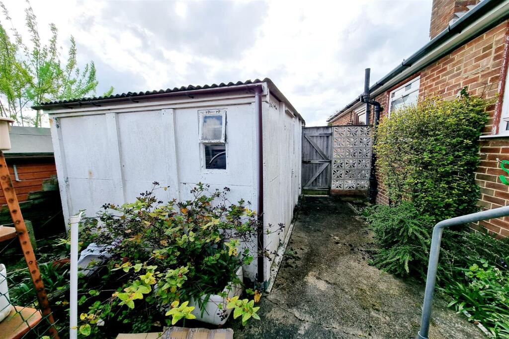 AREA TO SIDE &amp; GARAGE: