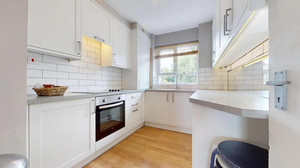 Bright and modern kitchen featuring a clean des...