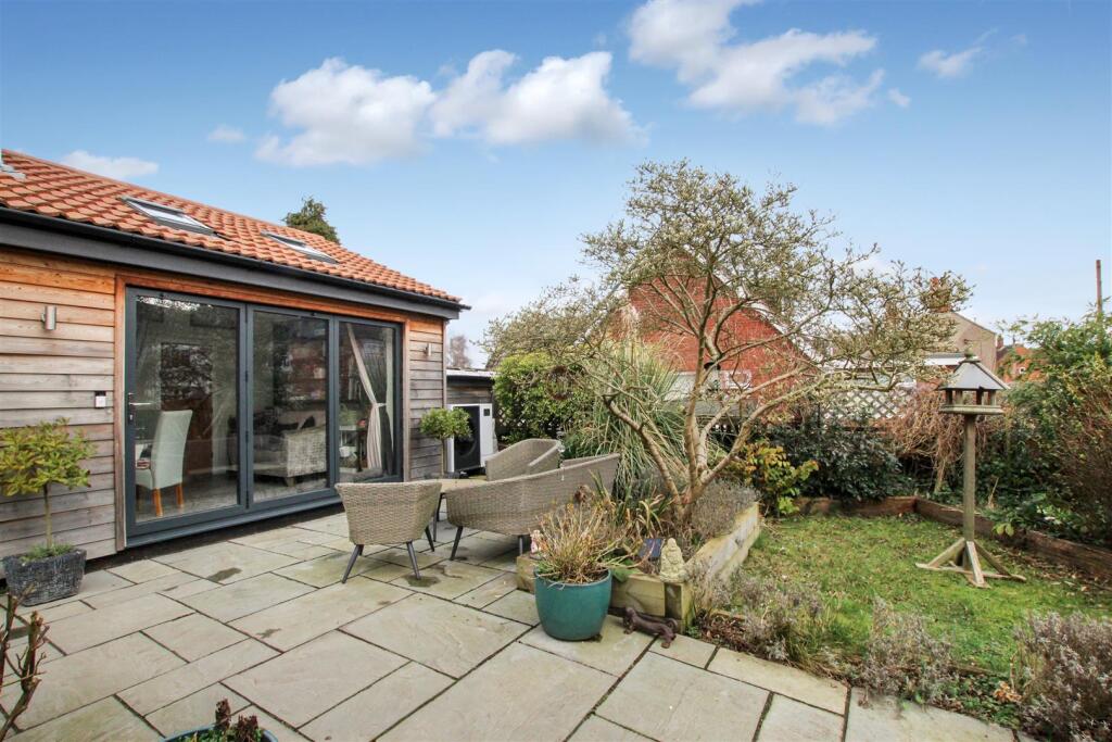 Patio Area, Side Extension and Garden.JPG
