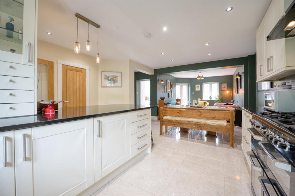 Kitchen towards dining area and lounge.jpg