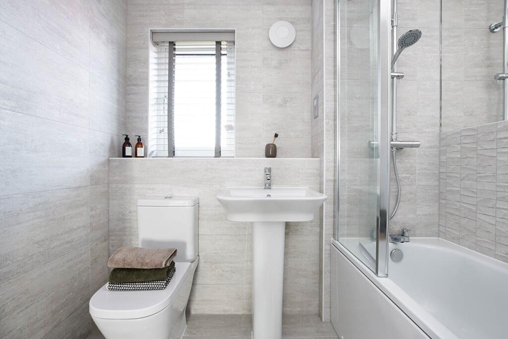 Bathroom with shower over bath - typical Taylor Wimpey home