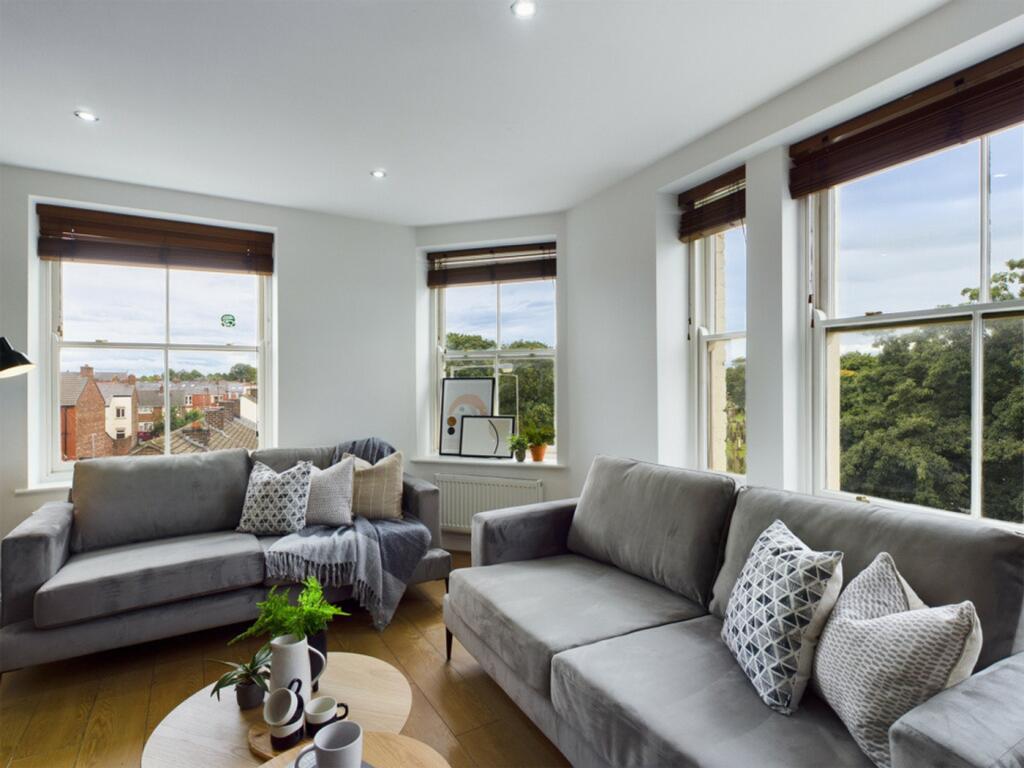 A spacious and stylish modern living room with ...