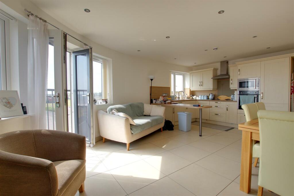 LIVING ROOM WITH KITCHEN AREA