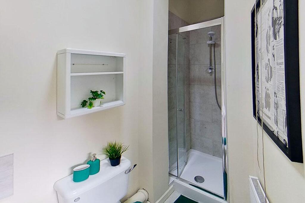 This modern bathroom features a sleek shower wi...