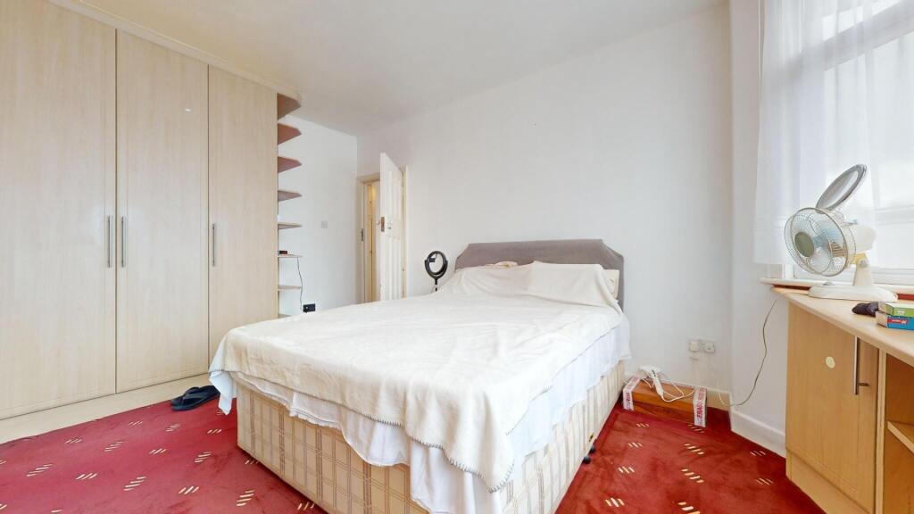 Bright and tidy double bedroom featuring a comf...