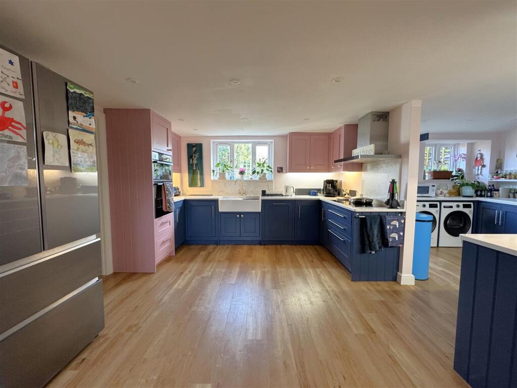 Kitchen through to the utility area.jpeg