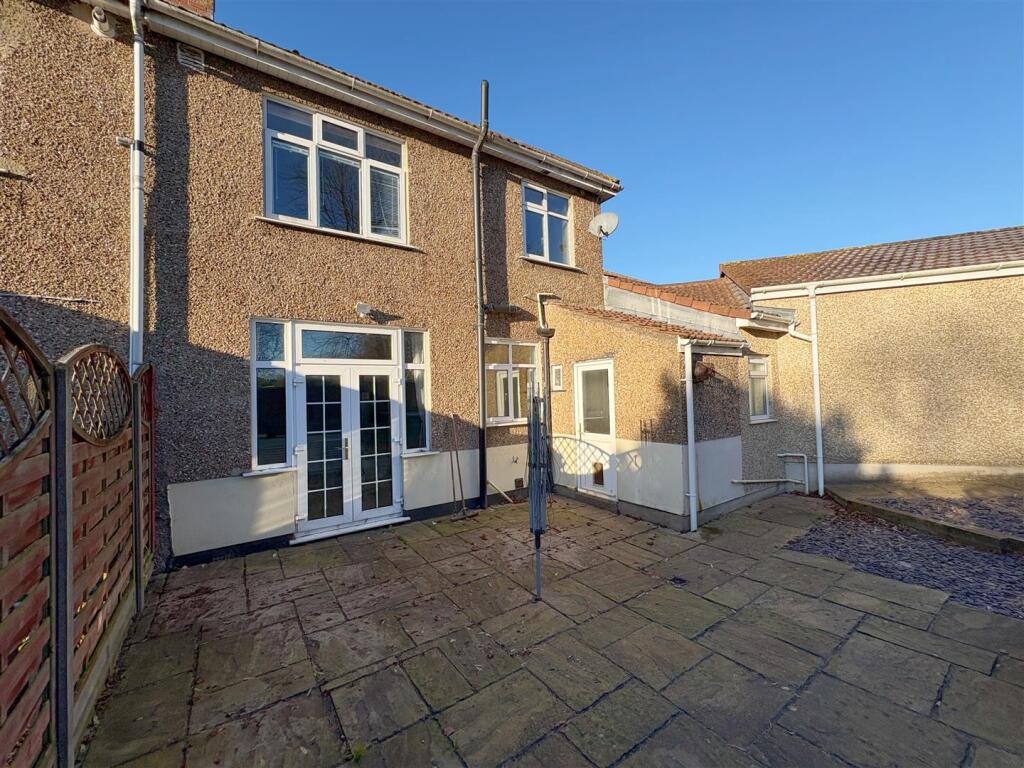 Rear view of property and patio (1).jpg