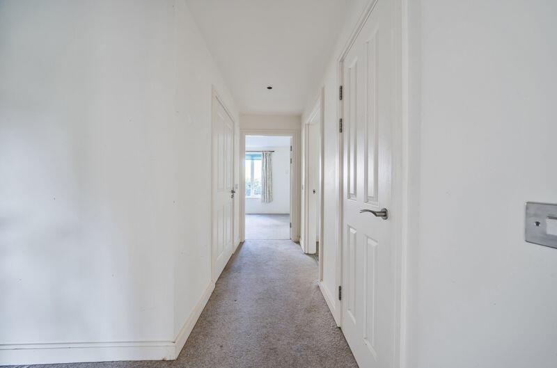 Hallway with storage cupboard