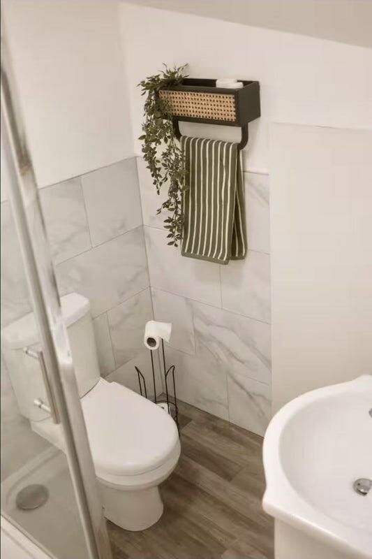 A modern and clean bathroom space featuring a w...