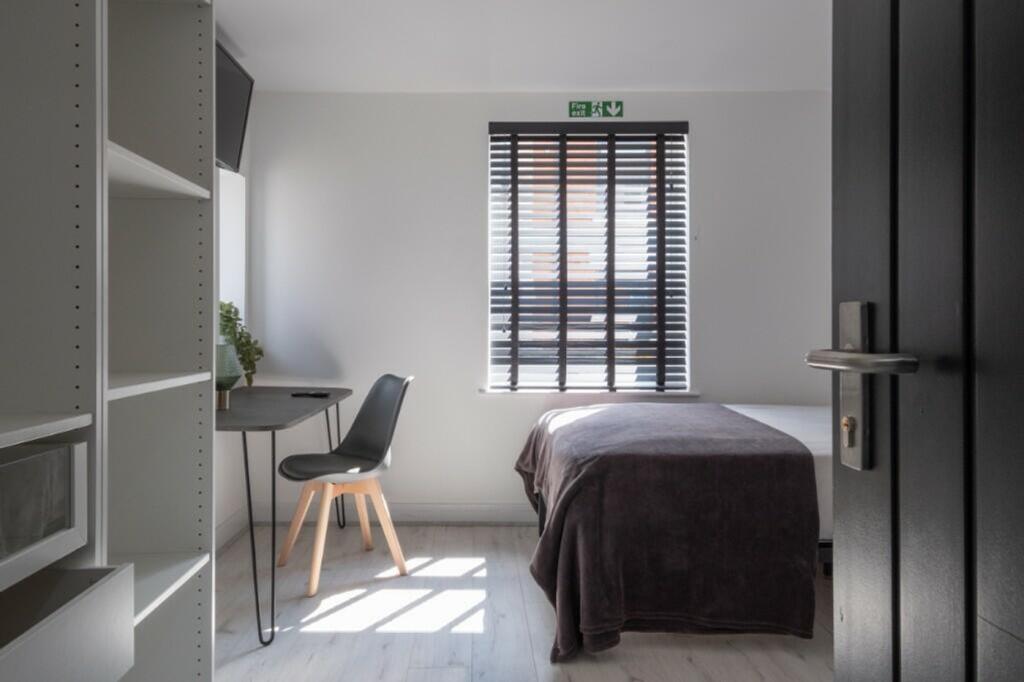 A beautifully designed double bedroom featuring...