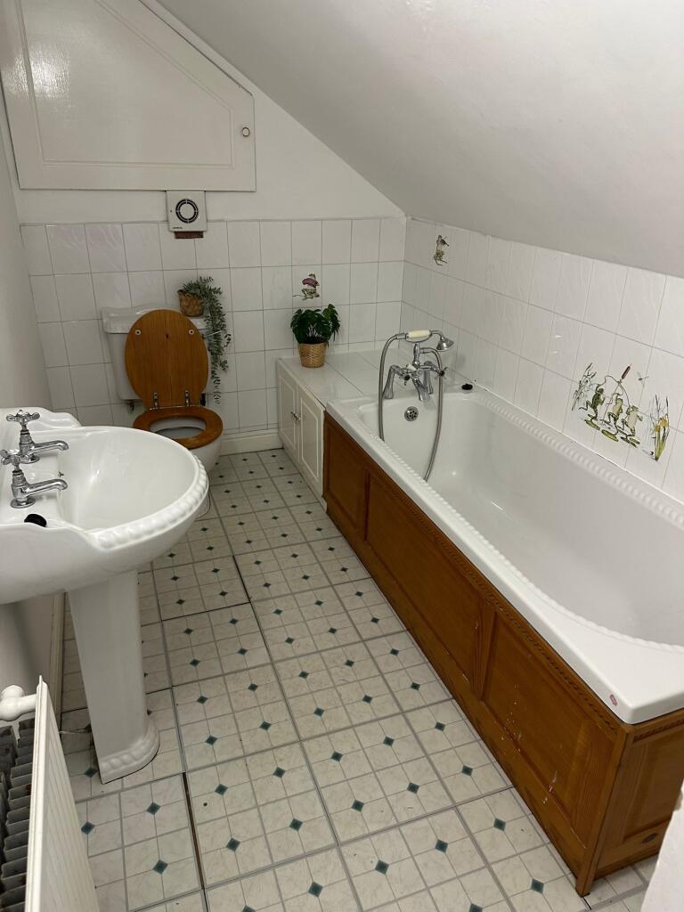 A clean, well-maintained bathroom featuring a b...