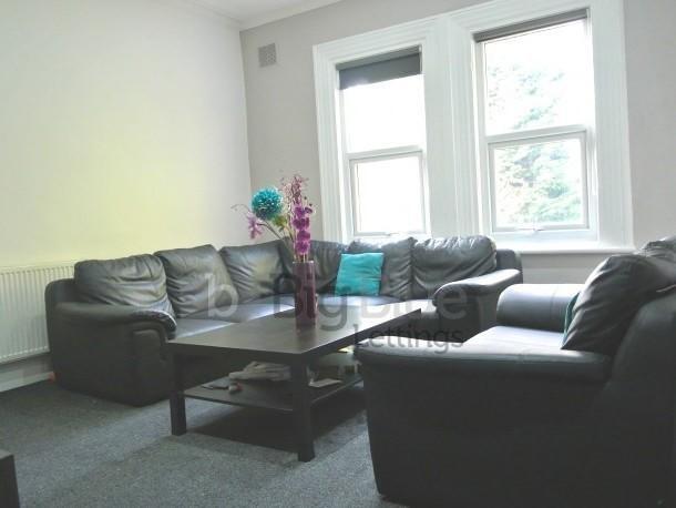 Bright and inviting living room featuring comfo...