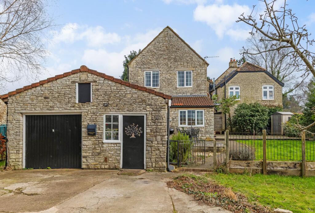 Front Facade with Double Garage and Ample Parking
