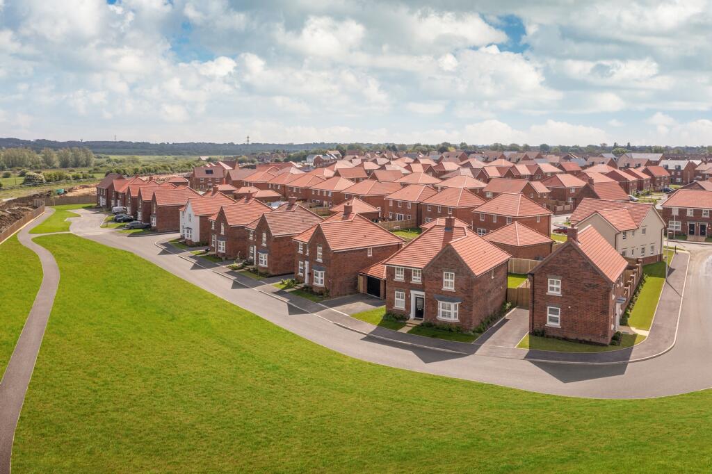 Family homes opposite green space at Meadowburne Place May 2024