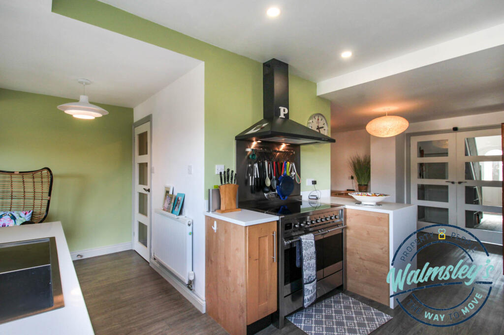 Kitchen with pantry &amp; doors to the hallway