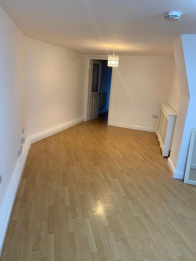 A clean and well-maintained hallway with light ...