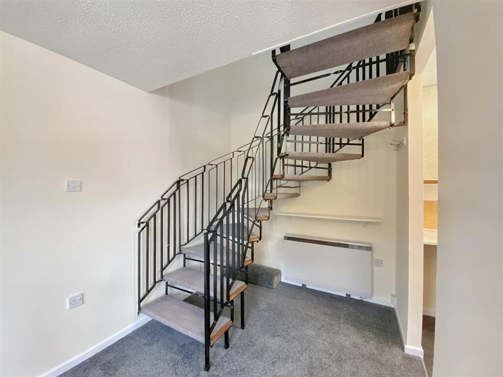 Stairs leading to first floor