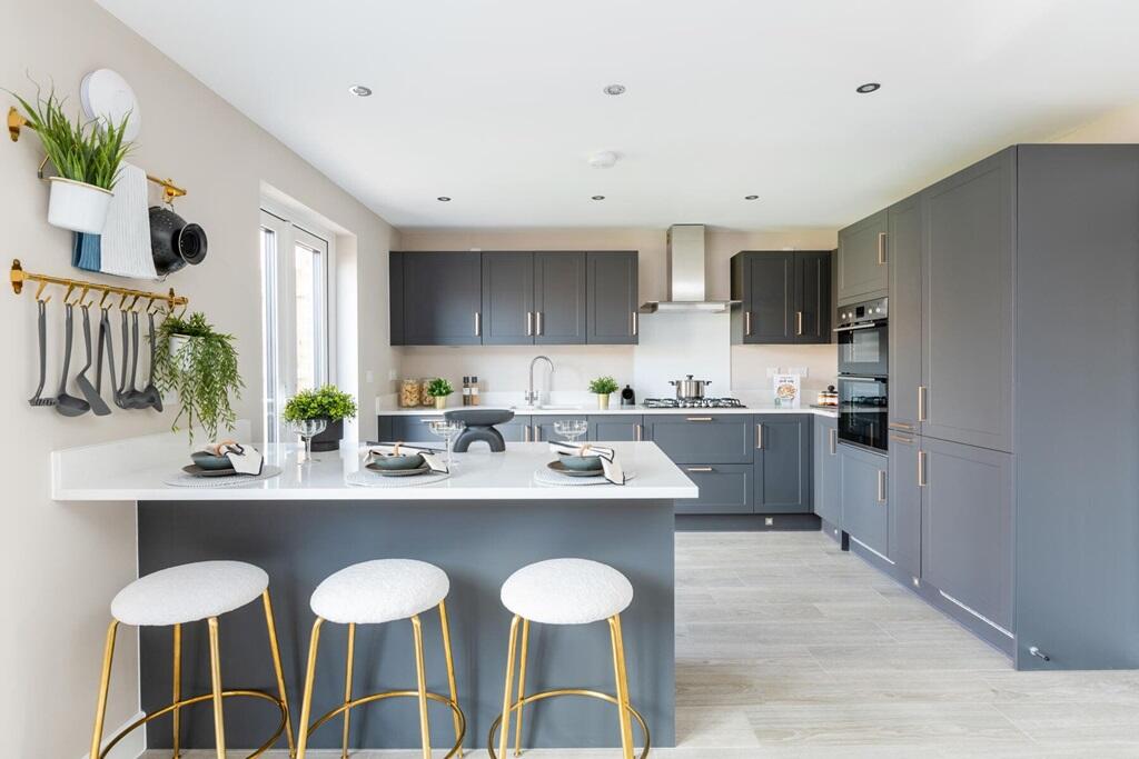 A modern kitchen with breakfast bar