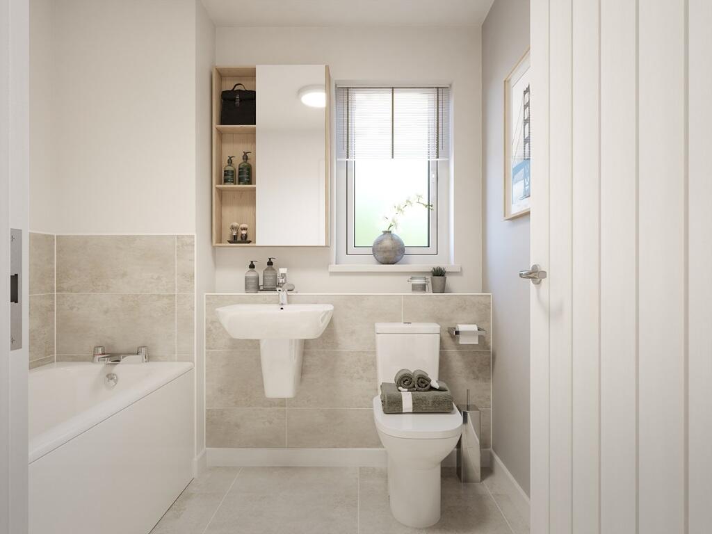 The main bathroom features high quality fixtures and fittings