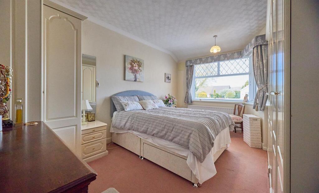 BEDROOM ONE TO FRONT