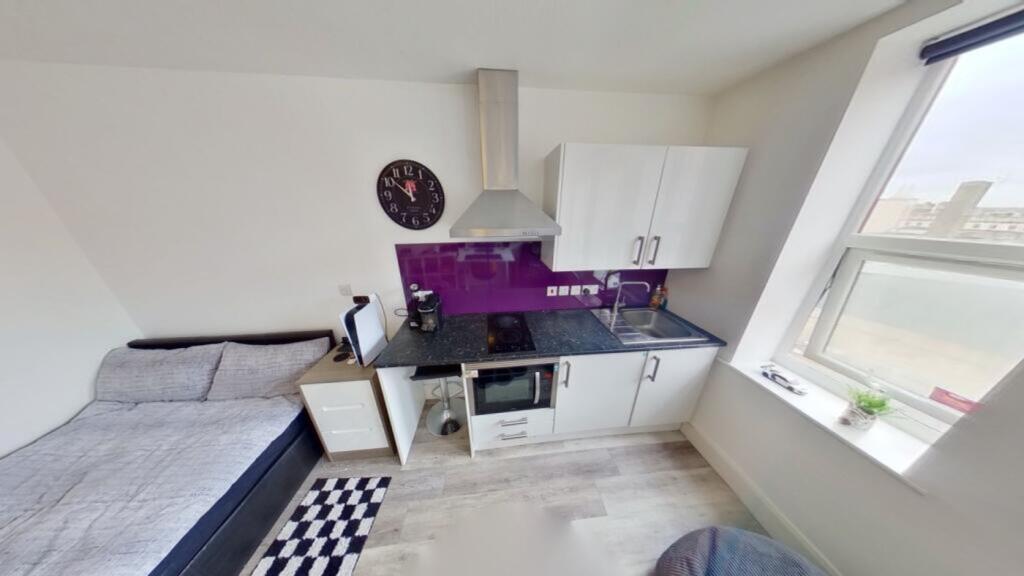 This charming kitchen area features modern appl...