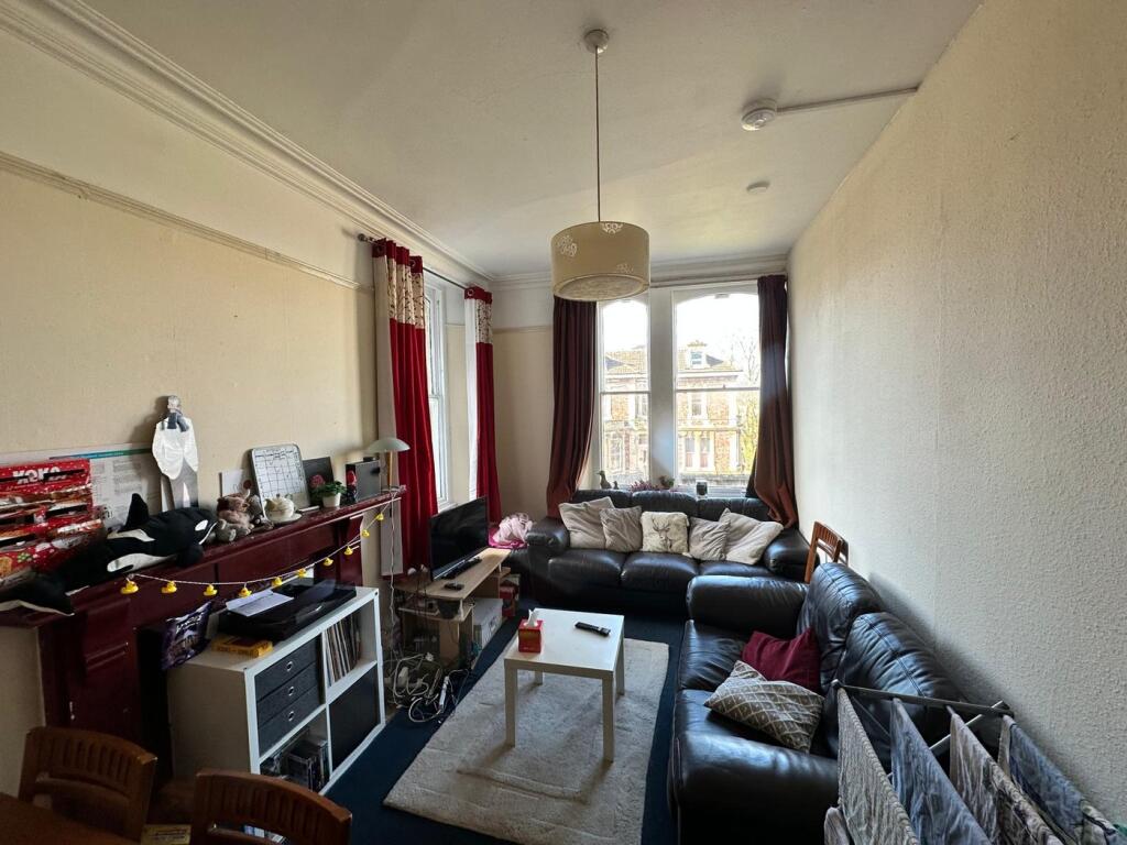 Bright and inviting living room featuring a spa...