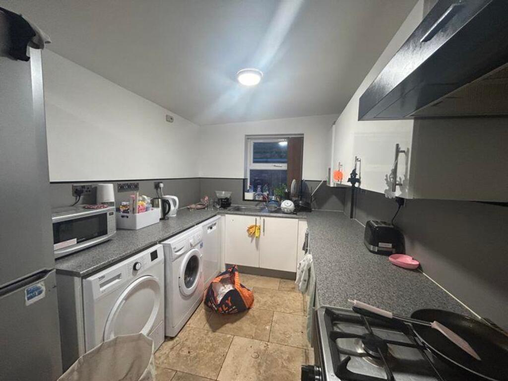 A modern and functional kitchen with ample spac...