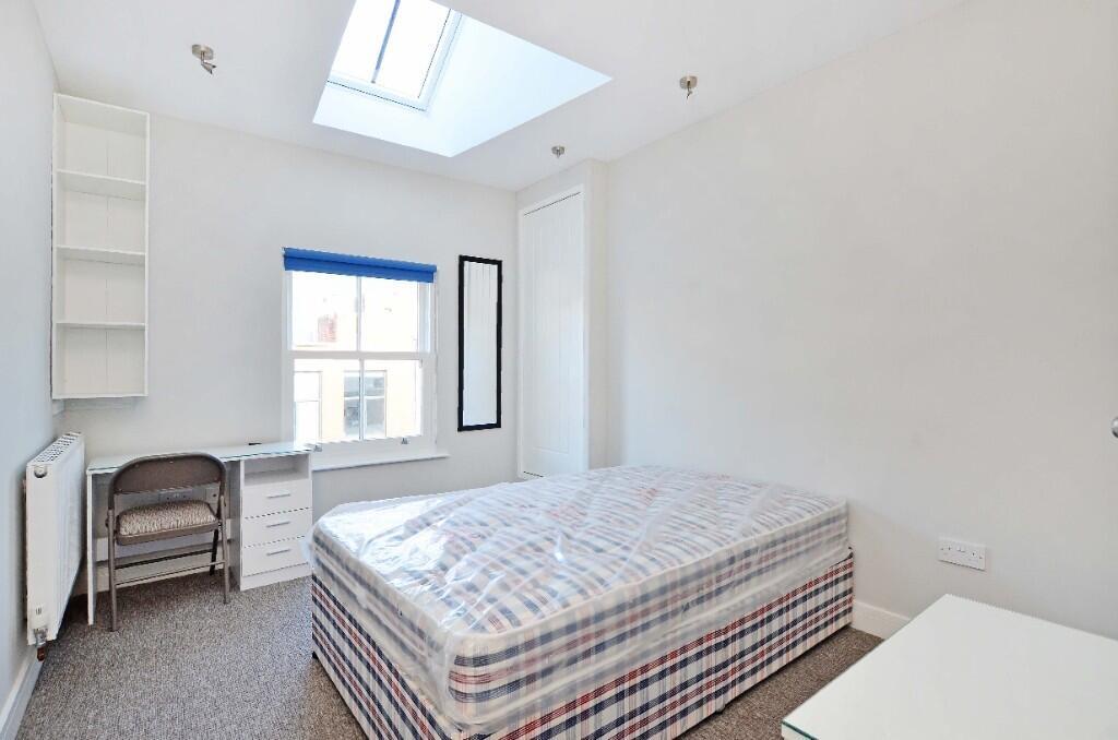 Bright and tidy double bedroom featuring a comf...