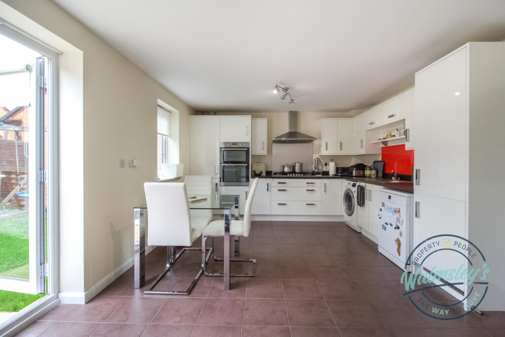 Kitchen dining with french doors to garden