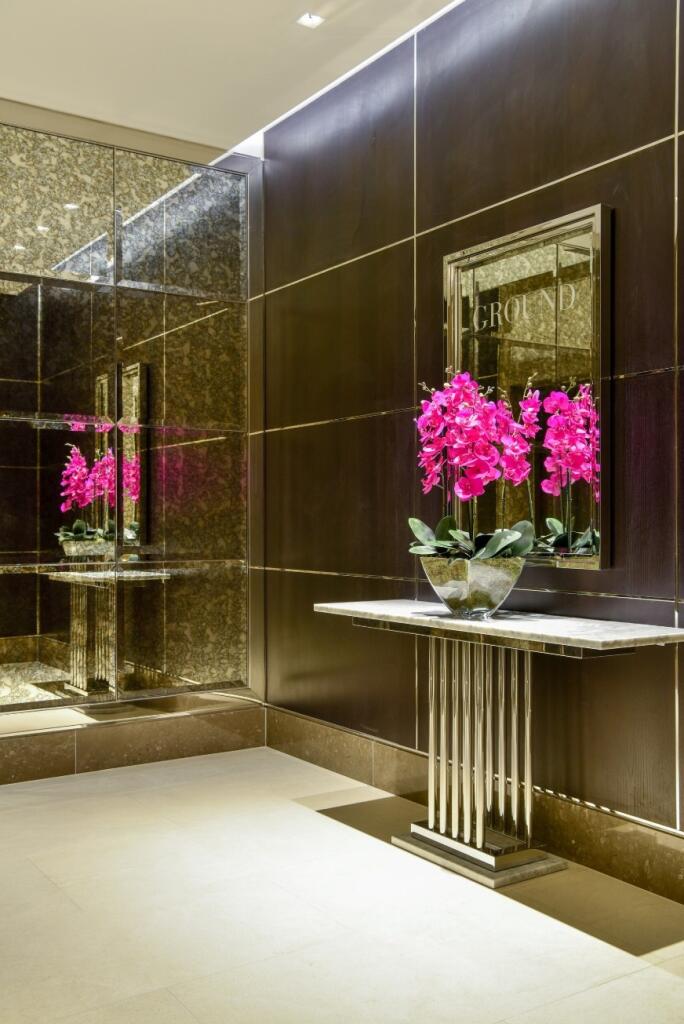 A stylish and modern reception area featuring a...