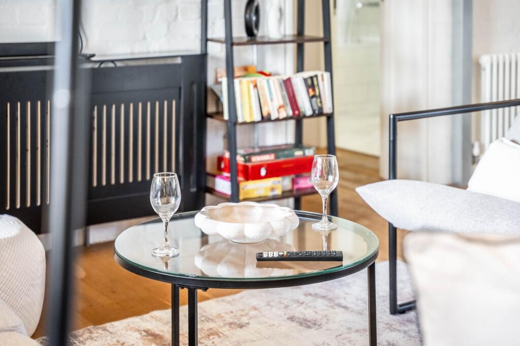 Experience a cozy and inviting living room, per...