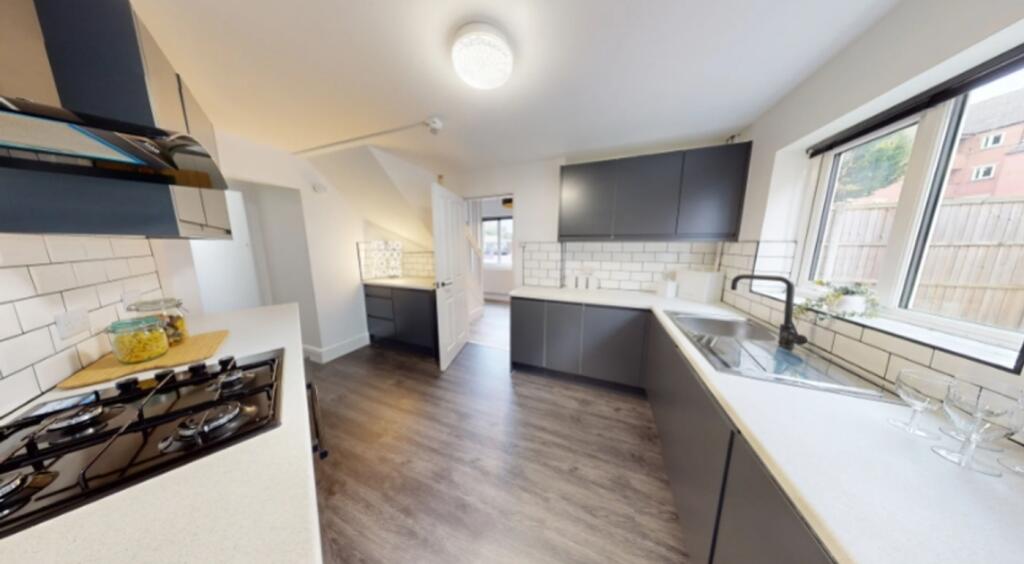 A modern and spacious kitchen with ample counte...