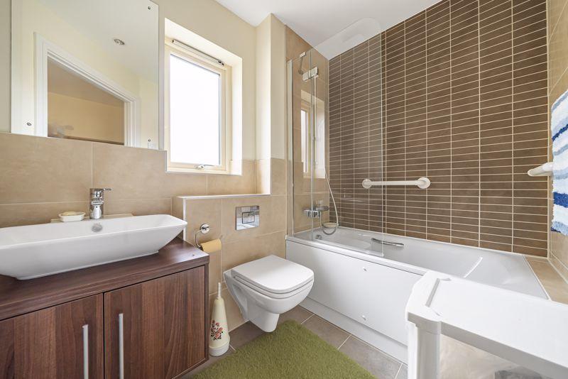 Bathroom with over-bath shower