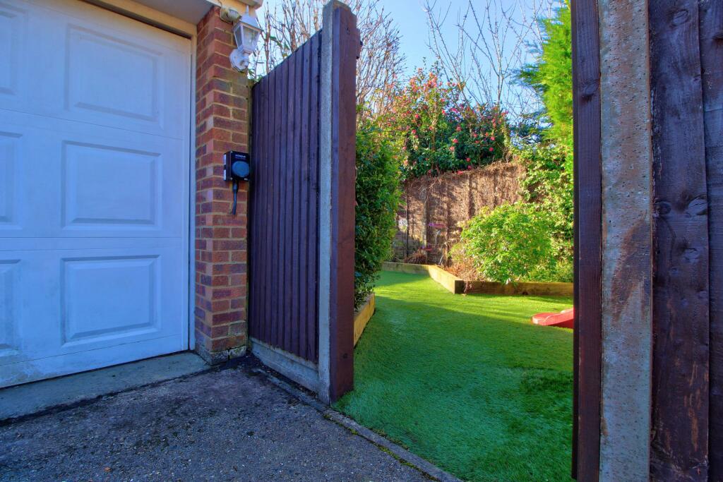 Detached garage with EV charger and garden access