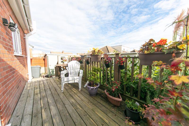 Raised sun deck to house