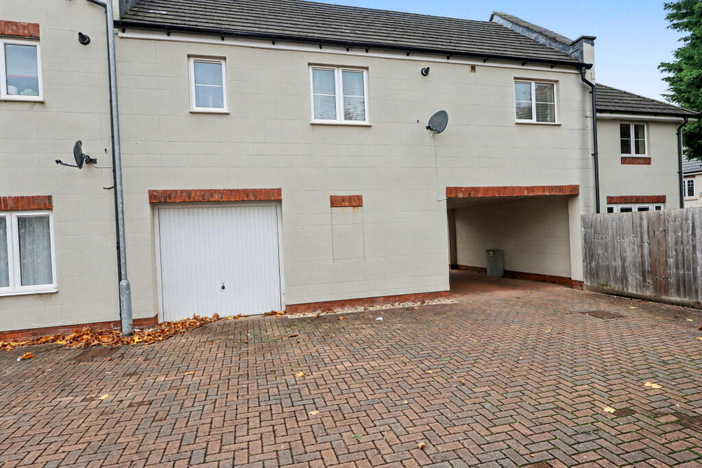Rear elevation with garage and adjoining store
