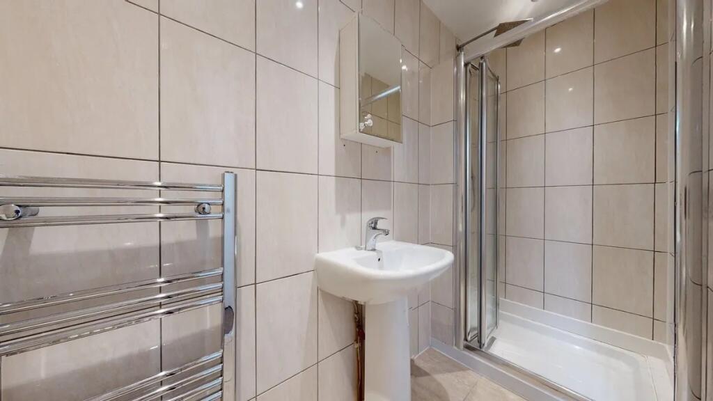 Bright and well-maintained bathroom featuring a...