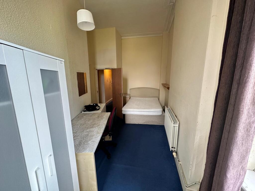 A bright and spacious double bedroom featuring ...