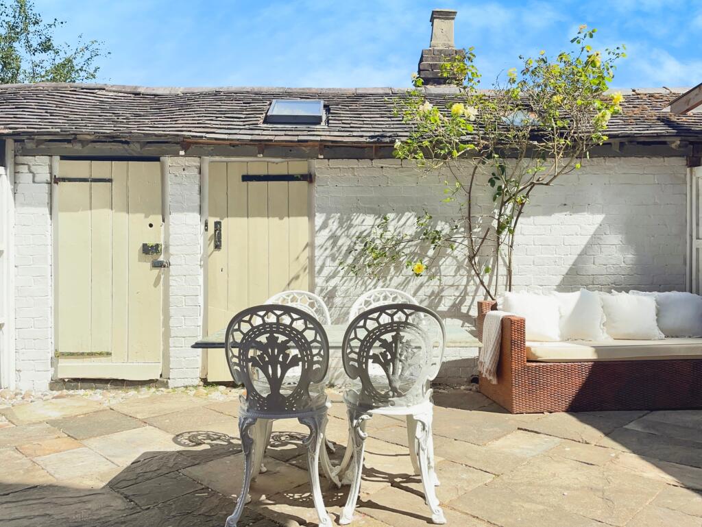 Rear Patio with Outbuildings