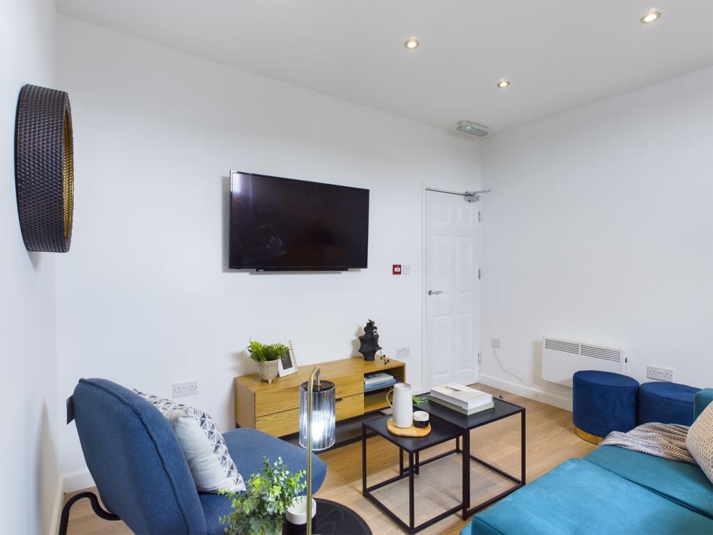 A bright and stylish large modern living room, ...