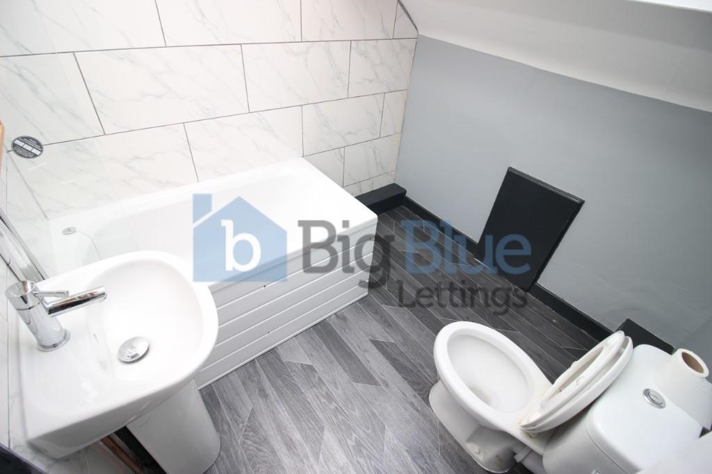Bright and clean bathroom featuring a modern wh...