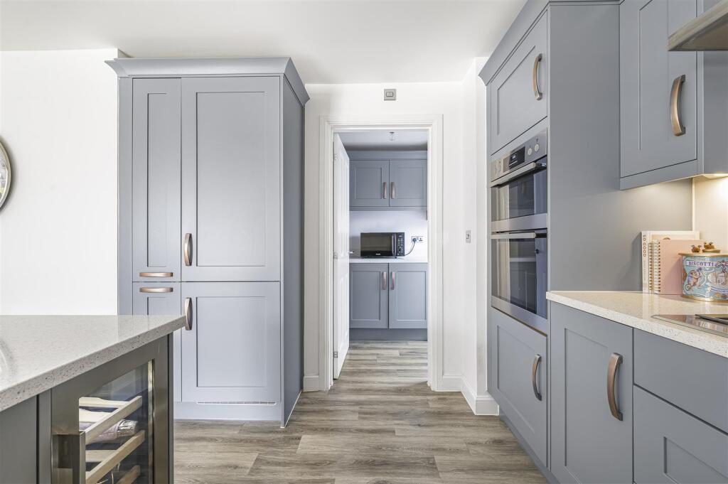 Kitchen through to Utility Room