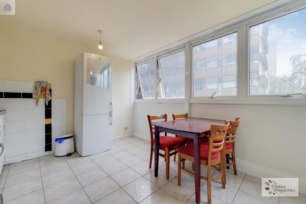 Bright and functional kitchen with large window...