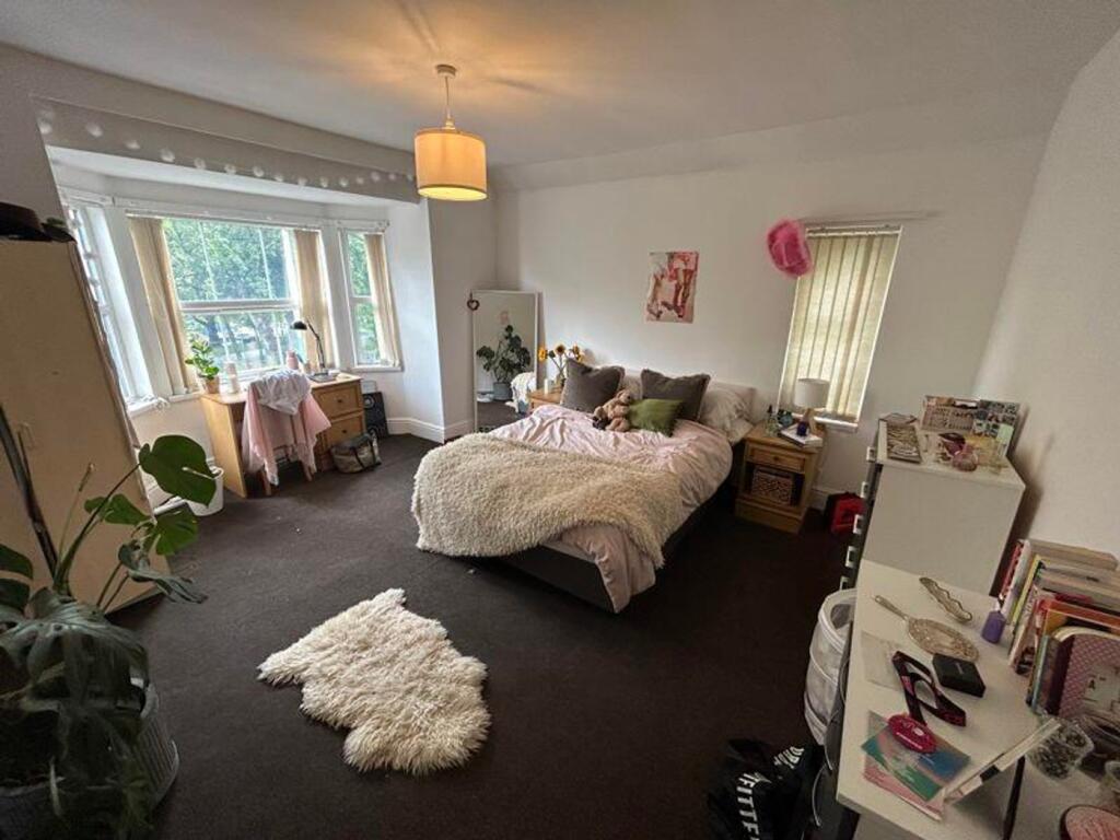 A spacious and inviting large double bedroom fi...