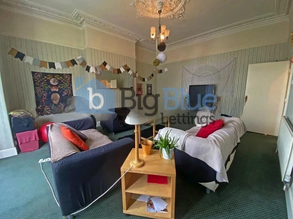 A spacious and inviting master bedroom featurin...