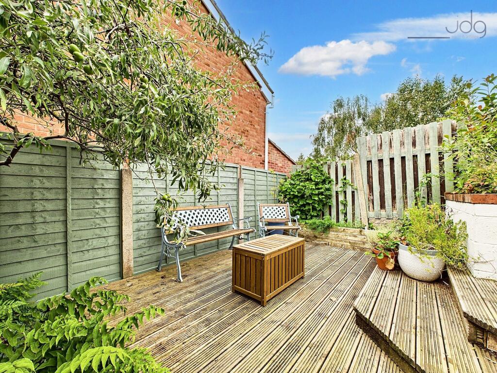 Tiered Garden with plenty of seating areas, flagged, decked and mixed lawn.