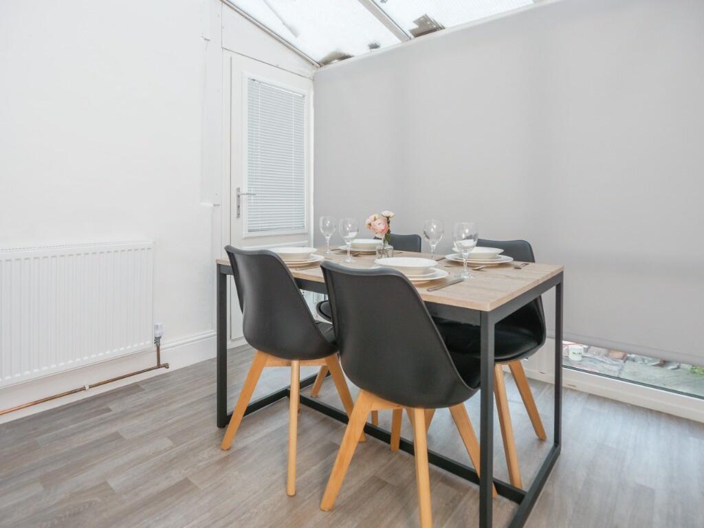 Bright and modern communal dining area featurin...