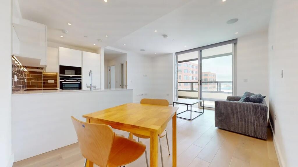 A modern, bright living room with an open-plan ...